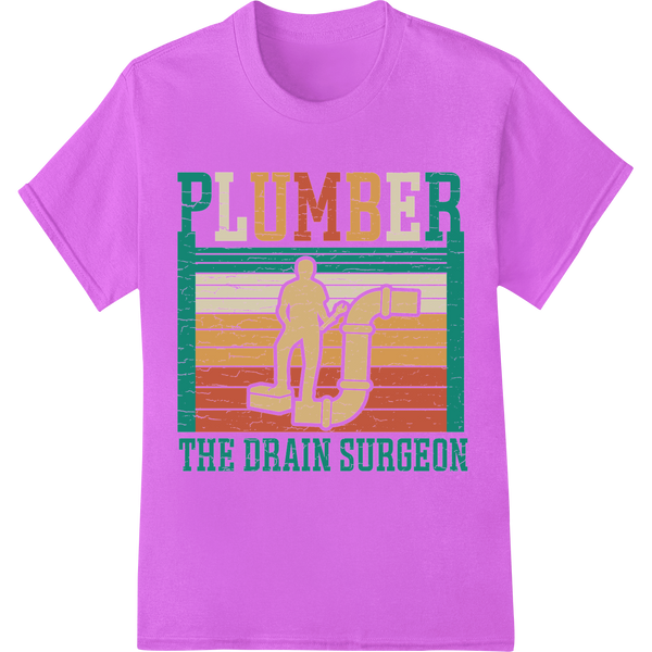 Plumber: The Drain Surgeon - Witty Vintage DTF Print Design on purple shirt - SUPERDTF-DTF Prints-DTF Transfers-Custom DTF Prints