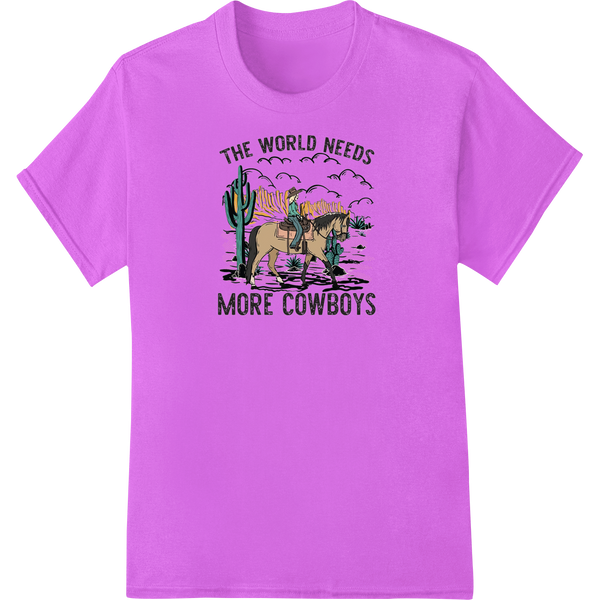 Green t-shirt with a black and white graphic print of a cowboy silhouette and the phrase 'Saddle Up! The World Needs More...