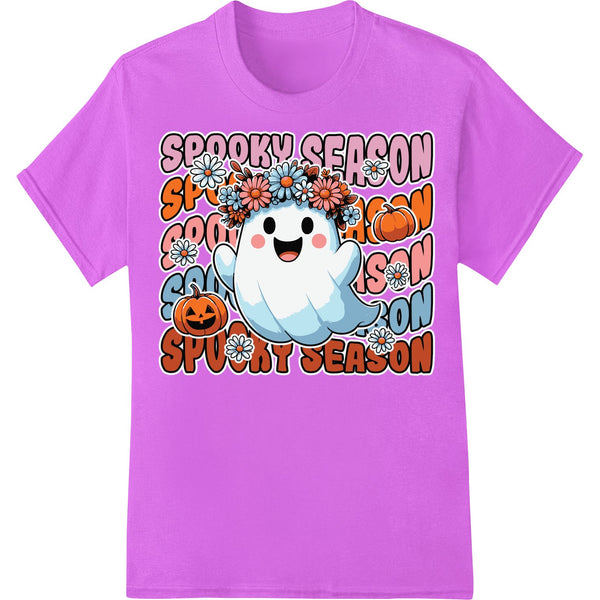 A colorful direct-to-film heat transfer design showing cartoon ghosts, jack-o-lantern pumpkins, and stars against an orange...