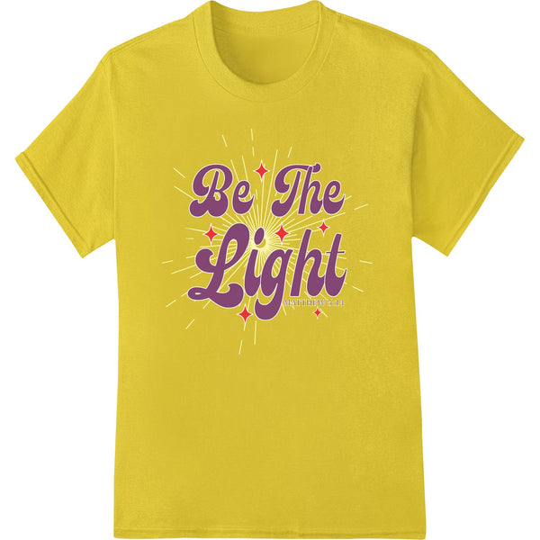 Inspirational typography design with 'Be The Light' text in bright colors on a plain background, ideal for DTF printing.