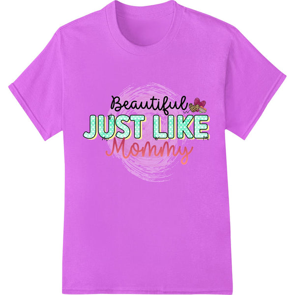 Heartwarming design of mother embracing daughter, with text 'Beautiful Just Like Mommy' - perfect for Mother's Day DTF...