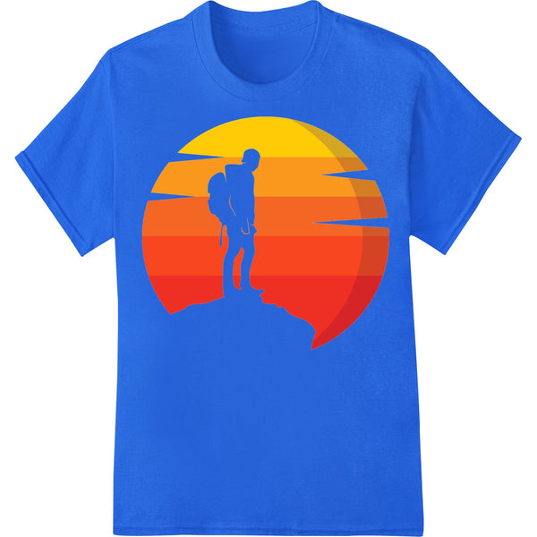 Silhouette of a hiker standing on a mountain ridge with arms raised, against a colorful sunset sky background. DTF print...