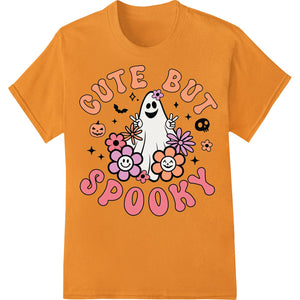 Cute cartoon ghost design with the words 'Cute But Spooky' printed on a gray t-shirt as a DTF (Direct to Film) heat transfer