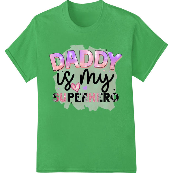 A heartwarming DTF printed design featuring text 'Daddy is my Superhero' and a superhero figure holding a child's hand.