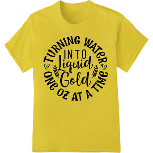 Liquid gold motivational text design with a water droplet, suitable for direct-to-film printing on apparel and accessories