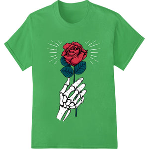 DTF heat transfer print of a skeletal hand delicately holding a vivid red rose against a black background